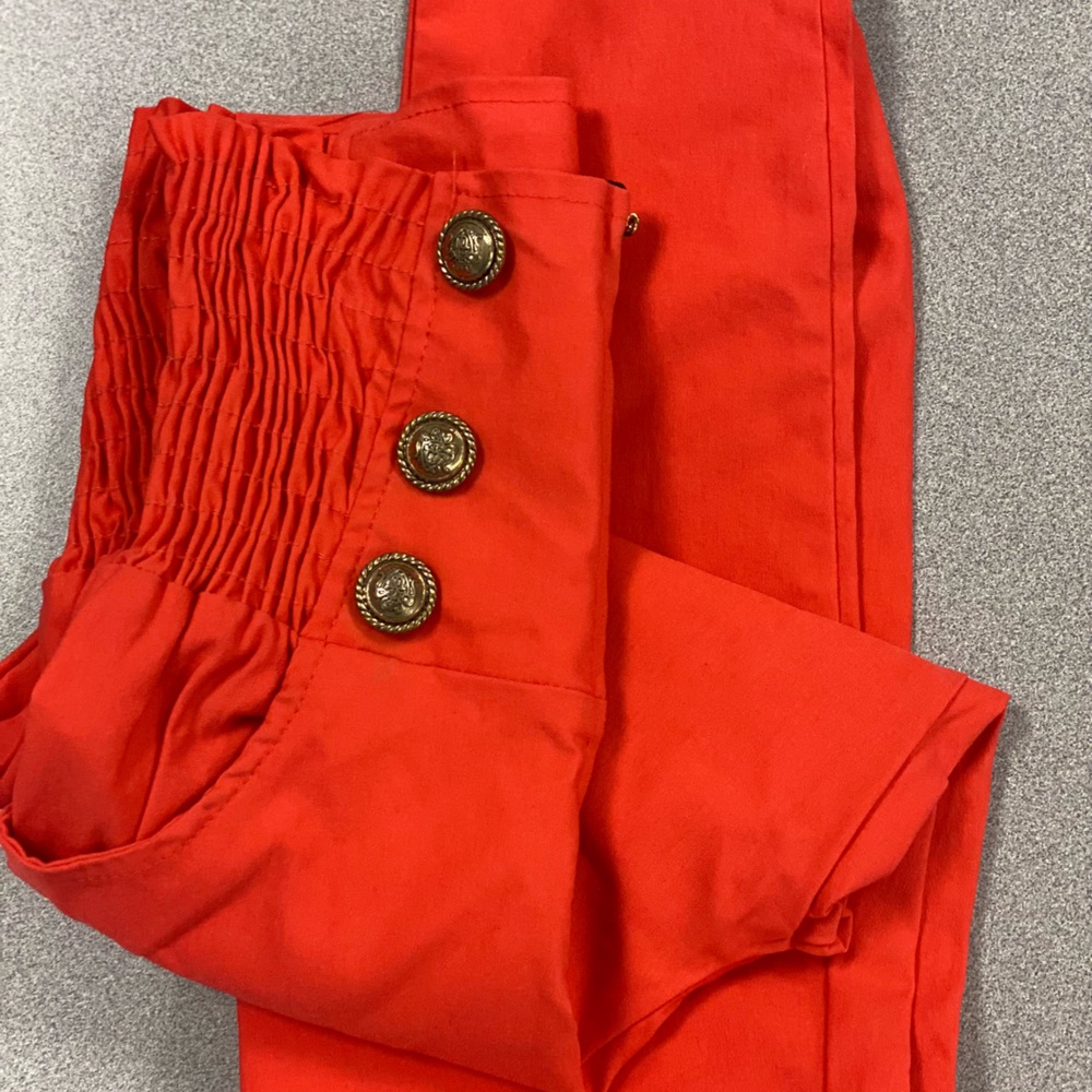 Crimson Red pants with cute buttons.